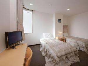 Giường trong phòng chung tại Hotel Sunshine Iwaki +251 ảnh