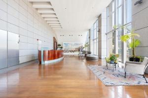 a large hallway with a lobby with chairs and tables at Mr Neve Tsedek in Tel Aviv +72 photos