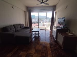 a living room with a couch and a table at Star Regency Home Stay in Brinchang