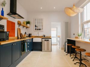 a kitchen with blue cabinets and a counter top at 33 Lorne Street in Chester