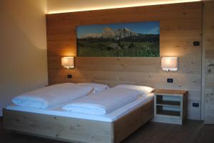 Postel nebo postele na pokoji v ubytování Hotel Garni Walter