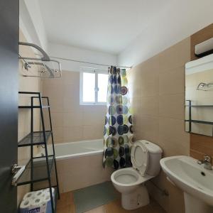 a bathroom with a toilet and a sink at Meneou Apartment in Meneou