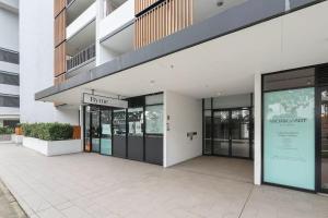 a building with a sign on the side of it at Bright & Stylish 2-Bedroom Escape in Gordon in Gordon