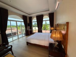 a bedroom with a bed and a large window at Kalamung Resort and Pool villas in Ao Nang Beach +86 photos
