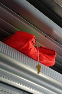 a red cloth hanging from the top of a ceiling at Komodo Archipelago Cruise in Labuan Bajo