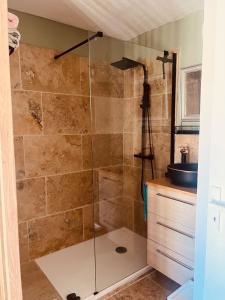 a shower with a glass door in a bathroom at Appartement - Sanary-sur-Mer in Sanary-sur-Mer
