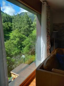 a window with a view of a mountain view at Andorre Ordino Arcalis in El Serrat
