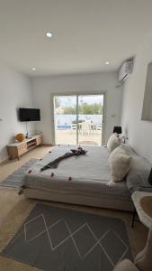 Ένα ή περισσότερα κρεβάτια σε δωμάτιο στο Villa Paco 2 suites & piscine privée proche du lagon