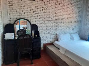 Postel nebo postele na pokoji v ubytování Fresco Village