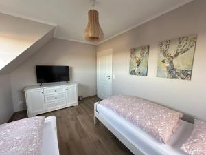 Katil atau katil-katil dalam bilik di Ferienwohnung Oberförstchen