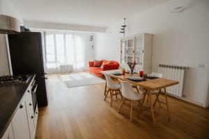 a kitchen and dining room with a table and chairs at GuestHost - Mecenate Bright Apartment Milan in Milan