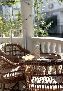an outdoor table and chairs with a candle on it at Osik apartments villa 01 in Golem