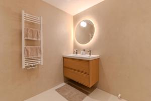 a bathroom with a sink and a mirror at City & Trainhouse in Alkmaar +21 photos