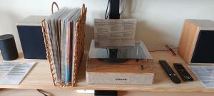a pile of albums sitting on top of a desk at Casa Buen Camino in Arzúa
