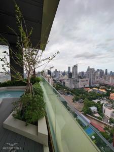 a view of a city from the balcony of a building at Brand New 2 bedroom near Paragon in Pratunam
