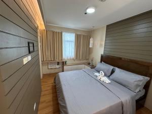 Katil atau katil-katil dalam bilik di Urban Stay in Seawind 1BR with Flexi +53 gambar