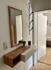Un pat sau paturi într-o cameră la Ferienwohnung - Auszeit - Buchholzer Straße 29 +3 fotografii