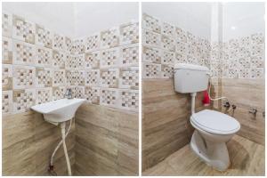 un bagno con un water e un lavandino di SPOT ON Maharani guest house a Ayodhya