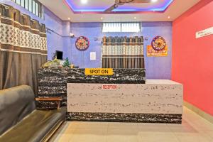 a store with a counter in a room at Hotel O Homely Residency in Guwahati