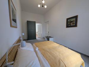 a bedroom with a large bed in a room at U Bílého Beránka in Děčín