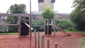 a playground with a slide and a ladder at Hotel in der Strassen in Solingen