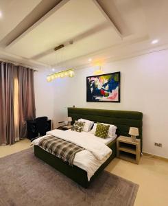 Ένα ή περισσότερα κρεβάτια σε δωμάτιο στο Tee and Tee 4 Bedroom Apartment, Victoria Island, Lagos, Nigeria