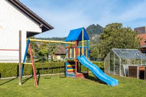a playground with a slide in a yard at Ferienwohnung Hewenpanorama in Engen