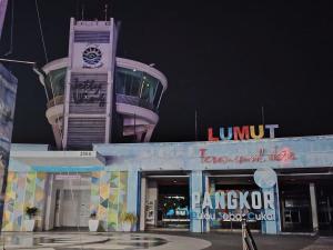 a building with a clock tower on top of it at Ed 03 lumut Waterfront in Lumut +2 photos