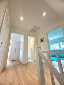 a room with a hallway with two doors and a balcony at Dreamily charming apartment 