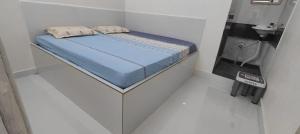 Postel nebo postele na pokoji v ubytování Ahobilam Sri Lakshmi Home Stay