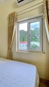 Postel nebo postele na pokoji v ubytování Hotel CÔ CÚC