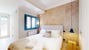 Кровать или кровати в номере Sol y El Madroño