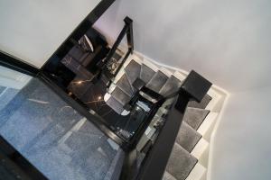 an overhead view of a room with a staircase and a stair case at The Scouse Suite in Liverpool