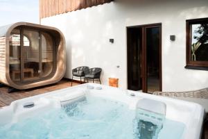 a jacuzzi tub in the middle of a house at Bierhotel in Oberstdorf