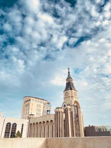 a building with a clock tower on top of it at 달빛그리기Moonlight in Daegu