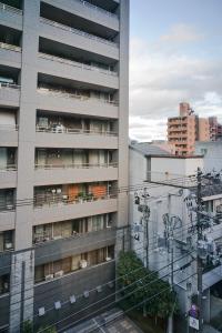 a tall building with a lot of windows at KIORI Hotel Higashino Toin in Kyoto