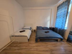 a bedroom with two beds and a window at perfect apartment in Freiberg in Freiberg