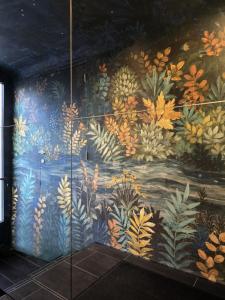 a mural on the wall of a room at Mons Hypercentre in Mons +13 photos