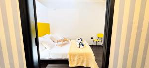 a bedroom with a dog sitting on a bed at Tema apartment by Ca-Sa Check in Chioggia