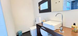 a bathroom with a sink and a toilet at Tema apartment by Ca-Sa Check in Chioggia