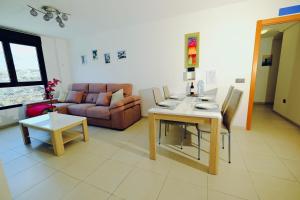 a living room with a table and a couch at Malpais in Puertito de Güímar