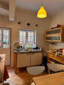 a kitchen with stars on the wall above a sink at Casa Mira in Odemira
