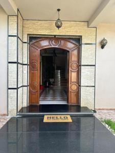 an entrance to a building with a sign on the floor at villa serenity Families Tanger in Tangier +23 photos