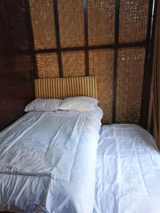 Ένα ή περισσότερα κρεβάτια σε δωμάτιο στο Homestay Guest House Kang Ayak