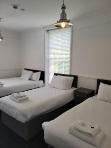 a room with two beds and a window at Nysdill Accommodation Ltd in Norwich +56 photos