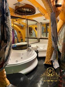 a large bathroom with a tub and two sinks at PENTHOUSE PATTAYA in Pattaya Central