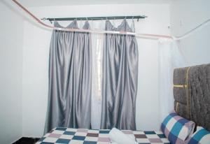 Ένα ή περισσότερα κρεβάτια σε δωμάτιο στο Cozy house
