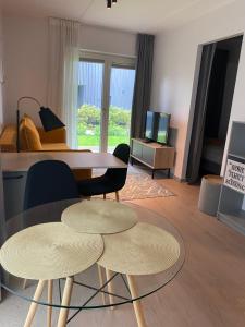 a living room with a table and two chairs at Kalamaja Garden in Tallinn