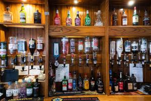 a bar with a lot of bottles of alcohol at Top Hoose Amble in Amble