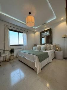 Ένα ή περισσότερα κρεβάτια σε δωμάτιο στο Agréable Appartement calme & Style